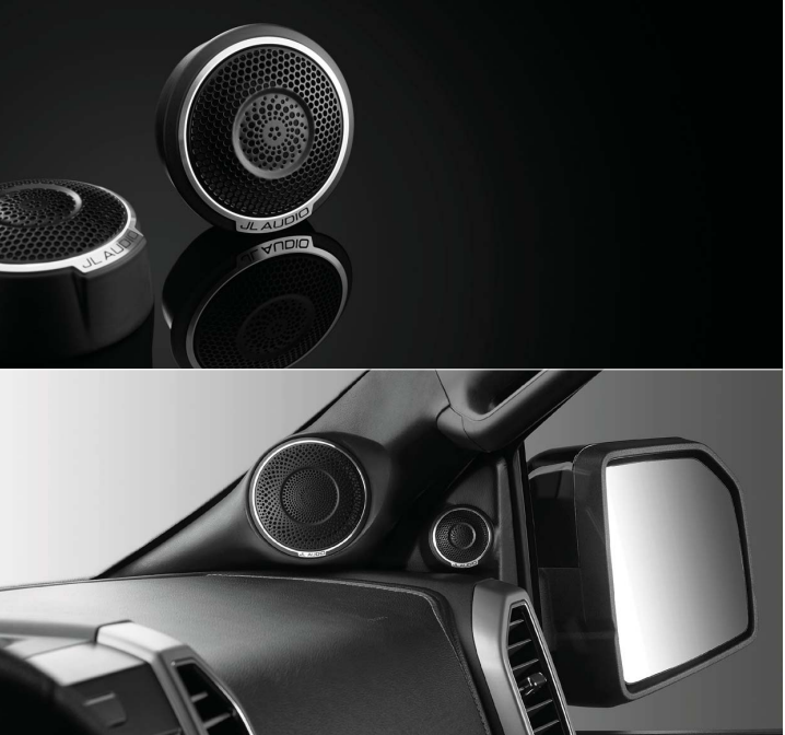 Black JL Audio speakers installed inside the car near the right front mirror